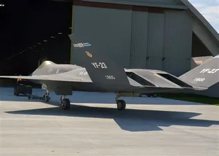 YF-23 from left rear in front of hangar